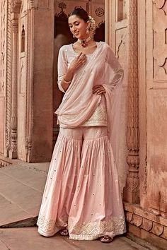 Shop for PREEVIN Pink Embroidered Peplum Kurta Sharara Set for Women Online at Aza Fashions Pink Ruffled Sets For Eid, Traditional Sharara With Ruffles And Peplum Shape, Traditional Peplum Sharara With Ruffles, Fitted Pink Sharara With Ruffles, Pink Fitted Sharara With Ruffles, Festive Pink Ruffled Anarkali Set, Festive Pink Ruffled Sharara, Pink Bollywood Sharara With Ruffles, Pink Peplum Sharara For Festive Occasions