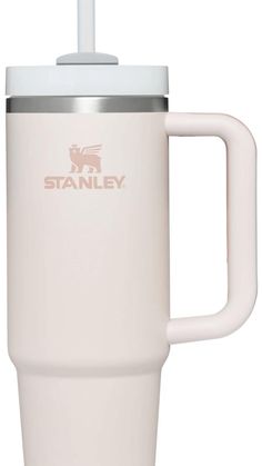 the stanley travel mug is white and has a stainless steel lid with an insulated handle