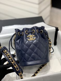 SHOP MORE LUXURY PRODUCTS HERE Description Chanel Small Drawstring Bucket Navy Blue Bag For Women 19cm/7.5in Size: 19 x 15 x 12.5 cm / 7.5 x 6 x 5 in Golden MetalCC logoNavy blue Includes dust bag.This product is of the premium quality. Navy Blue Bag, Louis Vuitton Shirt, Chanel Shirt, Gucci Gg Marmont, Reversible Belt, Luxury Products, Belt Accessories, Bag For Women, Chanel Handbags