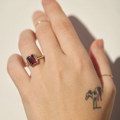 Gifts of Jupiter Garnet Ring | Catbird Luxury Emerald-cut Ruby Ring, Emerald Cut Ruby Ring With Multi-stone, Lab-created Ruby Baguette Cut Gemstone Jewelry, Baguette Cut Lab-created Ruby Gemstone Jewelry, Luxury Garnet Jewelry With Center Stone, Baguette Cut Gemstone Jewelry For Proposal, Luxury Garnet Rings With Accent Stones, Ruby Birthstone Ring With Gemstone Accents As Gift, Emerald Cut Multi-stone Ruby Jewelry