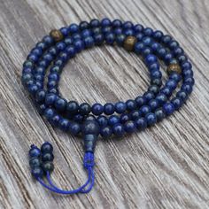 "Birthstone Month: December Zodiac: Libra Chakra: Third Eye and Throat Materials: Lapis lazuli stone & Brass (mantra carved bead) Size of beads: 6 mm each The Tibetan mantra \"Om Mani Padme Hum\" is carved The mala is around 17 inches long from top to bottom Number of beads: 108 Mantra-carved beads are used as a spacer bead The thread is blue in color with a sliding knot Handmade in Nepal. Lapis Lazuli, renowned for its mesmerizing deep blue hue, has captivated humanity for centuries due to its beauty and profound spiritual significance. As the birthstone for December and associated with the zodiac sign Libra, lapis lazuli holds a special place in the hearts of those seeking its healing properties. In addition, lapis lazuli aligns with specific chakras, particularly the third eye and throa Libra Chakra, December Zodiac, Tibetan Mantra, Lapis Lazuli Jewelry, Om Mani Padme Hum, Zodiac Sign Libra, Blue Lapis Lazuli, Les Chakras, Lapis Lazuli Stone