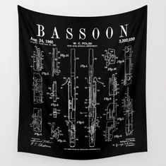 a black and white wall hanging with the words bassoon on it