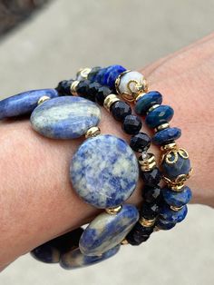 *7in. Genuine Blue Lapis Lazuli and Sodalite *18kt. gold filled beads *18kt. gold plated accent beads *Coin genuine Sodalite *Blue goodnight  * quality stretch cord for a comfortable fit *Made in 7in length.  Message our shop if you need a bigger size and we would be glad to do that for you. Sizing  Measure your wrist with a string and measure the string with a ruler or measuring tape.  Be sure to add an inch or two foe desired fit. Blue Spiritual Stackable Beaded Bracelets, Blue Spiritual Stackable Jewelry, Blue Stackable Jewelry With Round Beads, Healing Blue Stackable Bracelets, Blue Gemstone Stretch Bracelet As Gift, Crystal Bracelets Diy, Bracelets Design, Gems Bracelet, Beads Bracelet Design