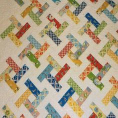 a quilt made with different colored squares on it