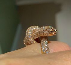 This awesome Diamond Snake Ring, A Victorian Symbol of Eternal Love. The eyes have 2 marquise cut diamonds encrusted. All the diamonds are white and very sparkling. Good quality diamonds and the ring is solid 18K Rose gold, feels nice and heavy. Diamonds all set smooth. You see sparkles from any direction all covered with diamonds. This is definitely a conversation piece work of art to behold. Genuine natural round brilliant cut diamonds total weight: 4.25 carats Clarity: SI Color: F/G Our diamo Luxury Snake Ring With Diamond Accents, Luxury Diamond Snake Ring, Luxury Snake Ring With Diamond Accents For Anniversary, Luxury Diamond Snake Ring For Anniversary, Luxury Diamond Snake Ring With Single Cut Diamonds, Luxury Snake Ring With Brilliant Cut Diamond, Luxury Diamond Snake Ring With Brilliant Cut, Luxury Snake Ring With Single Cut Diamonds For Anniversary, Luxury Diamond Snake Ring With Pave Setting