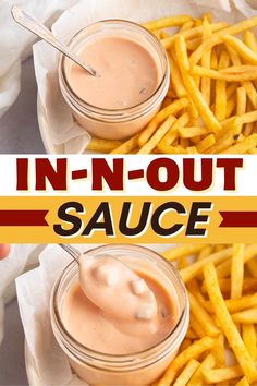 two small jars filled with sauce sitting on top of french fries next to each other