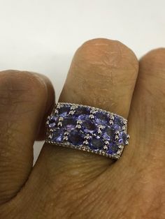 Unusual Deep purple blue Tanzanite Sterling Filigree Setting Handmade size 6 Can be resized, my jeweler uses a laser and charges a $10 -$20 fee. All rings are shipped in a nice gift box. Check out our over a THOUSAND great reviews Engraving is $4 per letter and is not always perfect depending on the piece. It can take a few days if the jeweler is busy. This is payable to Paypal Judithsltd@gmail.com Formal Blue Amethyst Ring, Fine Jewelry In Blue Amethyst, Fine Jewelry Blue Amethyst Jewelry, Blue Oval Amethyst Ring In Sterling Silver, Blue Multi-stone Amethyst Ring As Gift, Purple Tanzanite Sapphire Ring As A Gift, Lavender Tanzanite Ring For Gift, Blue Amethyst Ring With Accent Stones In Sterling Silver, Purple Tanzanite Rings As A Gift