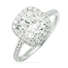 a cushion cut diamond ring with pave set shoulders