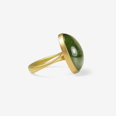 Details Lola Brooks 18k yellow gold & oval green tourmaline ring, size 7 1/4. The 20.57ct stone measures approximately 3/4" x 5/8″ & is set in Lola’s signature delicate bezel setting. - green tourmaline, 20.57ct - 18k yellow gold - size 7 1/4 Sizing This ring can be resized. Please allow 2 - 6 weeks. Inquire about sizing fee. 14k Gold Green Gemstone Dome Ring, Green Oval Dome Ring For Formal Occasions, Green Domed Jewelry With Polished Finish, Luxury Green Domed Ring, Modern Green Oval Rings, Luxury Oval Green Dome Ring, Formal Green 14k Gold Dome Ring, Modern Green Round Dome Ring, Oval Tourmaline Emerald Ring In Yellow Gold