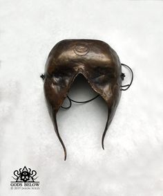 "This sightless bronze mask was designed for ritual application. The mask is 7.5\" long and 5.25\" wide. It features a warm liver sulfur and ferric nitrate patina. The mask hangs on a leather cord." Crow Skull, Skull Pendant, The Mask, Leather Cord, Ritual, Sculpture Art, Seattle, Patina, Etsy Seller