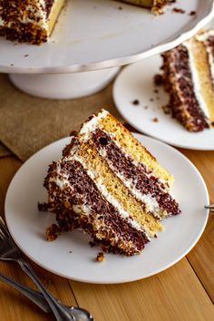 there is a slice of cake on the plate and another piece has been taken out