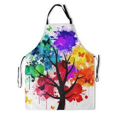 an apron with colorful paint splattered on it and a tree in the middle