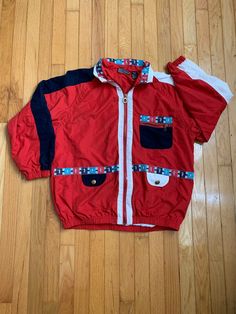 This Vintage 80s Mureli Sports Themed Women's Jacket celebrates women in sports, with a nod to nautical themes, red/white/blue, and the 80's and 90's. In amazing condition. Vintage Red Track Jacket For Outdoor, Retro Red Sports Outerwear, Vintage Red Sports Outerwear, Retro Sports Windbreaker With Pockets, Retro Red Track Jacket For Outdoor, Red Retro Track Jacket For Outdoor, Vintage Red Outerwear For Sports, Retro Sports Track Jacket With Pockets, Retro Red Sports Windbreaker