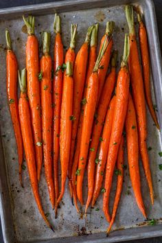 there are many carrots that have been cooked in the oven and ready to be eaten