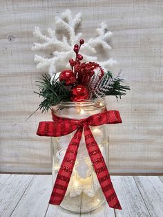 a mason jar filled with christmas decorations and lights