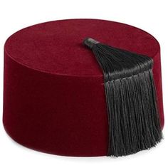 The Moroccan tarbouche is an iconic and traditional headwear piece that holds deep cultural significance in Morocco. It is a distinctive hat, often referred to as a fez in the Western world, and has become synonymous with Moroccan style and identity. The tarbouche is typically made from a soft, red felt material, though variations in color and fabric can be found. Its defining characteristic is its unique shape, featuring a cylindrical crown with a flat top and a tassel attached to the crown's center. The tassel is usually made from silk threads and can be a single color or multi-colored, adding an elegant touch to the overall design. The tarbouche is traditionally worn by men and can be seen as part of formal attire, especially during important occasions and ceremonies. It represents a sy Traditional Headwear, Moroccan Luxury, Aladdin Costume, Coconut Shell Crafts, Empire Ottoman, Moroccan Clothing, Style Marocain, Social Status, Western World