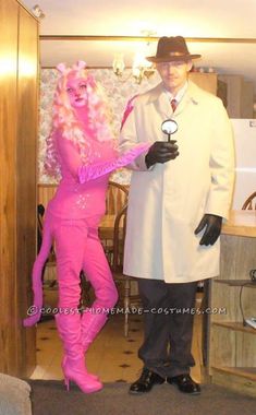 a man in a white coat and pink costume standing next to a woman