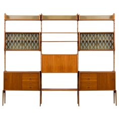 an art deco bookcase with drawers and shelves