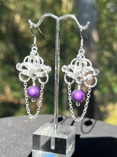 These unique chainmail earrings are handcrafted with bright aluminum rings using a Helm weave. An 8mm purple,  matte finish, glass bead is accented by a silver tone chain and attached to a silver plated ear wire. Using aluminum rings makes them both lightweight and comfortable to wear while still having a bold appearance.   Overall length 2 5/8" Dangle 2 1/8" Width 1" These earrings are a great addition to your jewelry collection or make a prefect gift. Please feel free to contact me with any qu Purple Metal Pierced Jewelry, Purple Pierced Metal Jewelry, Goth Earrings Diy, Chainmail Earrings, Wire Jewelery, Chainmail Jewelry, Goth Earrings, Earrings Diy, Diy Earrings