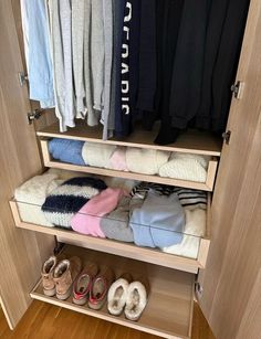 an organized closet with shoes and sweaters