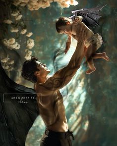 a man holding a baby in his arms while flying through the air with an umbrella