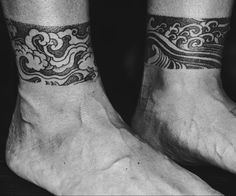 two people with matching tattoos on their feet