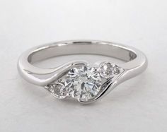 a white gold engagement ring with three stones