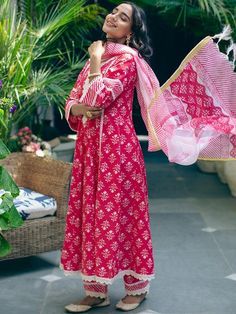 The white designs literally bloom in the deep bright fuchsia, giving it a very feminine vibe. Tops With Palazzo Pants, Red Palazzo Pants, Notched Neckline, Palazzo Pant, A Line Kurta, Indian Dresses Traditional, Dress Neck Designs, Embroidery Designs Fashion, Pant Suit