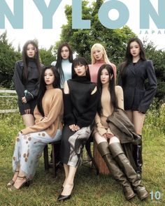 the cover of nylon japan magazine featuring models in black and tan outfits sitting on a bench