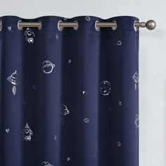 a curtain with space drawings drawn on it