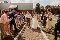 the bride and groom are walking down the aisle