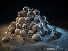 a pile of skulls sitting on top of a sandy ground next to an object in the dark