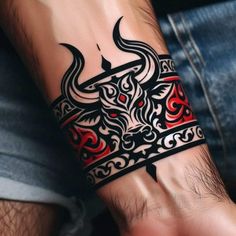 a man's arm with a bull tattoo on it