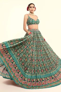 Bottle green blouse with floral print and thread, sequins, lace embroidery. Paired with coordinating lehenga and pink embroidered dupatta. - Aza Fashions Designer Green Choli With Floral Embroidery, Green Embroidered Saree With Mirror Work, Designer Green Lehenga With Floral Embroidery, Green Floral Embroidered Choli For Party, Summer Reception Green Lehenga, Green Anarkali Embroidered Fabric With Mirror Work, Green Anarkali Embroidered Fabric For Reception, Bollywood Style Green Lehenga With Floral Embroidery, Green Bollywood Lehenga With Floral Embroidery