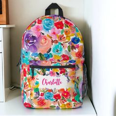 Elegant bright and bold modern vintage botanical spring summer flowers backpack with pretty oversized flowers and brush script  with a modern calligraphy typography with in multi colors, pink, rainbow, purple, blue, red, Floral Print Backpack For School In Spring, Spring Floral Print Standard Backpack, Oversized Flowers, Printed Backpack, Boho Backpack, Name Vintage, Festival Essentials, Calligraphy Typography, Brush Script