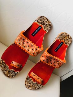 Orange embossed and Beaded Boho Style Kolhapuri Chappals/Sandals for Women, Shoes for Women, Women Flats, Slip Ons, Indian Ethnic flop flip, Royal shoes, traditional style Women, Wedding Shoes, Bridal Shoes, Orange Kolhapuri Chappals, Boho Sandals, Leather Sandals, Boho wedding sandals, Women Flats, Indian Sandals, Boho Barefoot Sandals An enticing and comfortable pair of Indian slippers. Must have in your shoe collection. Contemporary sandals which will compliment every kind of outfit. PERFECT Closed Toe Sandals For Wedding And Festive Occasions, Traditional Closed Toe Toe Ring Sandals For The Beach, Festive Closed Toe Sandals For Wedding, Traditional Sandals With Single Toe Strap For Festive Occasions, Festive Sandals With Gota Work And Single Toe Strap, Traditional Festive Sandals With Single Toe Strap, Festive Closed Toe Sandals With Gota Work, Festive Sandals With Gota Work For Diwali, Embroidered Sandals For Festive Occasions