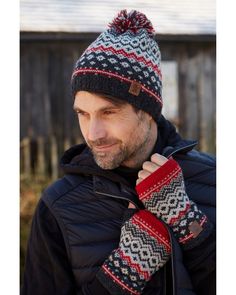 Inspired by the Scandinavian Mountains, with a diamond Fair Isle pattern, fine knit in super soft wool. Men's hand knitted soft wool fair isle bobble hat or handwarmers, Scandi design, fair trade and handmade in Nepal. The bobble beanie is partially lined with a band of fleece (around the head and ears) and the handwarmers are fleece lined too, for comfort and warmth.  Please make your item selection from the style drop-down menu. Available in Red Earth or Blue Mix  Finely knitted in soft wool Hand made Fairly traded Composition - 100% Wool outer, 100% Polyester fleece linings  Care - Machine wool wash max 30 degrees or cool handwash. Short spin. Dry flat. Do not tumble dry. Pachamama is a member of BAFTS - The British Association for Fair Trade Shops and Suppliers and has been designing a Red Wool Winter Hat, Red Winter Beanie, Winter Wool Knitted Beanie, Knitted Wool Beanie For Winter, Merino Wool Beanie For Winter, Winter Merino Wool Beanie For Cold Weather, Red Knitted Beanie For Winter, Red Knitted Winter Beanie, Red Knit Winter Hat