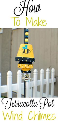 a white picket fence with the words how to make terracotta pot wind chimes