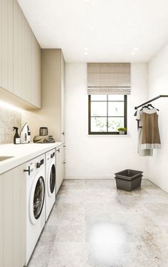 a washer and dryer in a white laundry room