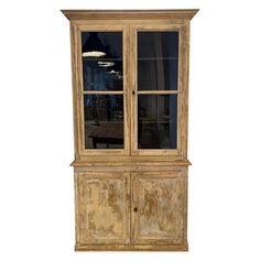 an old wooden china cabinet with glass doors on the top and bottom, against a white background