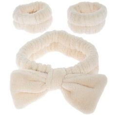 Band Thickness: 2" Size: One Size Fits Most Color: Cream Material: Fabric Care & Safety: Machine Washable UPC: 810137680019 Quantity: 1 Headband & 2 Wristbands Freshen your skincare routine with our Spa Headband & Wristbands. This soft elastic headband protects your hair while featuring a cute bow on the front to make your bathroom routine comfy and stylish. Additionally, it includes a set of matching wristbands to keep your arms and elbows dry. Say goodbye to stress and hello to relaxation with Palm Springs Pool Party, Bathroom Routine, Spa Headband, Elastic Headband, Elastic Headbands, Wristbands, Cute Bows, Say Goodbye, Skincare Routine