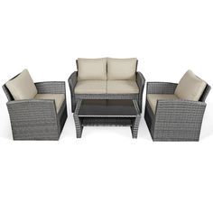 an outdoor furniture set with beige cushions