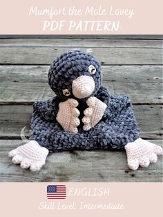 a crocheted penguin sitting on top of a blanket with text overlay that reads,