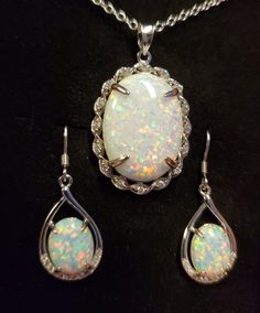 Wonderful White Fire Opals, Large Lab Created, 15x20mm Pendant 925 Sterling Silver With Cubic Zirconia Twist Design. This Opal Has Multicolored Fire, Lots Of Pink! See Video! Sterling Chain, Chain Length Options Available By Messaging Seller At Time Of Purchase. 925 Sterling Silver Earrings, Crystal Trim and Ear Wire Closures. Gift Box Included. Dazzling White Sterling Silver Jewelry Sets, White Oval Jewelry With Gemstone Accents, White Teardrop Hallmarked Jewelry, White Oval Stone Setting Jewelry, White Oval Stone Set Jewelry, Oval Pendant Jewelry Set For Anniversary, Silver Oval Jewelry Sets With Matching Earrings, Fire Opals, Fire Opal Necklace