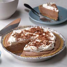 there is a chocolate pie with whipped cream on top