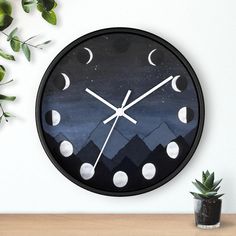 a clock that is on the wall next to a potted plant and some plants