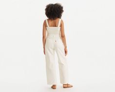 A no-brainer one piece that makes getting dressed that much easier. Our Drea Jumpsuit features bra-friendly, adjustable straps, a button-up front, two side pockets and a flattering standard fit. A no-brainer jumpsuit Cut with a loose fit Features a button-up front and adjustable straps With two side pockets White Levis, Getting Dressed, White Jumpsuit, Levi's, Adjustable Straps, Overalls, Button Up, Loose Fitting, Jumpsuit