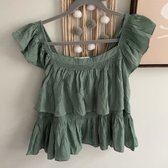 Size Large. Brand New, Never Worn! Ruffle Design With Elastic Neck And Sleeves To Wear Top Multiple Ways. Picture From Website In White To Show Length! (Selling In Green) Bohemian Ruffled Tops For Day Out, Bohemian Ruffle Tops For Day Out, Casual Tiered Tops For The Beach, Green Ruffle Hem Top For Spring, Summer Tops With Tiered Ruffle Hem, Summer Tops With Ruffle Hem And Tiered Shape, Summer Tiered Top With Ruffle Hem, Chic Tiered Cotton Top, Chic Tiered Tops For Beach