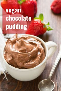 vegan chocolate pudding in a white bowl with strawberries on the side and text overlay