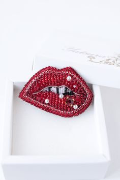 "Kiss me jewelry it is embroidered brooch by bead and gimp. Bridal Pin is a trendy item. Kiss me charm has a size 2.2*1.4 inches (5,5*3,5 cm). This lips wedding pin can be made with different crystals or charms according to your order. Red lips brooch - kiss me jewelry with Czech crystal beads. It will perfectly complement your unique jewelry collection or will be a wonderful gift for a special person. It can be used as a bridal brooch. Looks very elegant! Kiss brooch is carefully bead embroider Elegant Brooches With Appliques As Gifts, Valentine's Day Party Brooch Jewelry, Elegant Valentine's Day Brooch Jewelry, Red Brooch Jewelry For Valentine's Day, Red Brooch Pins For Valentine's Day, Handmade Red Brooches As Gift, Red Beaded Brooch For Party, Red Enamel Brooch Pin For Gift, Heart-shaped Brooch For Valentine's Day Gift